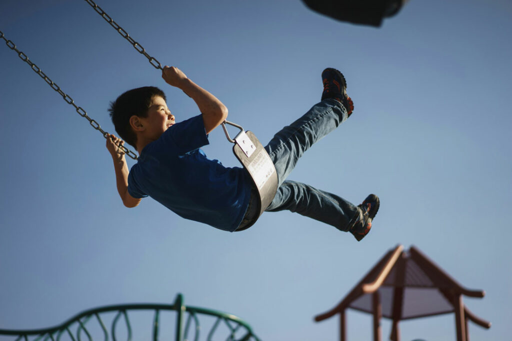 boy on swings